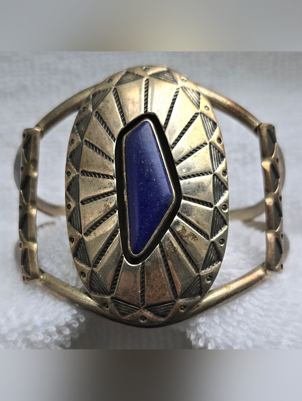 Signed sterling silver vintage Navajo cuff bracelet features Deep lapis lazuli